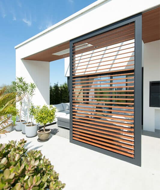 90mm Midi Louvre sliding panel 
Woodlook louvres and charcoal frame, powder coat finish