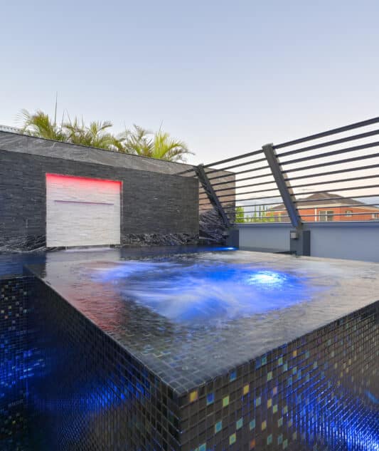 180 Airfoil Sun Louvres in custom steel frame 
Operable louvres for boundary privacy screen to spa